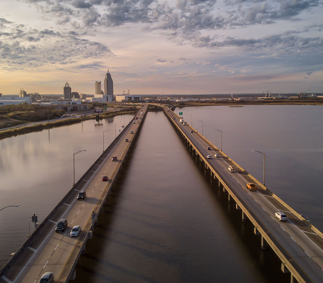 drone shot of bayway looking toward downtown mobile