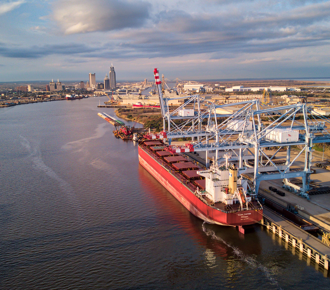 drone shot of mobile river with barges and ships in view