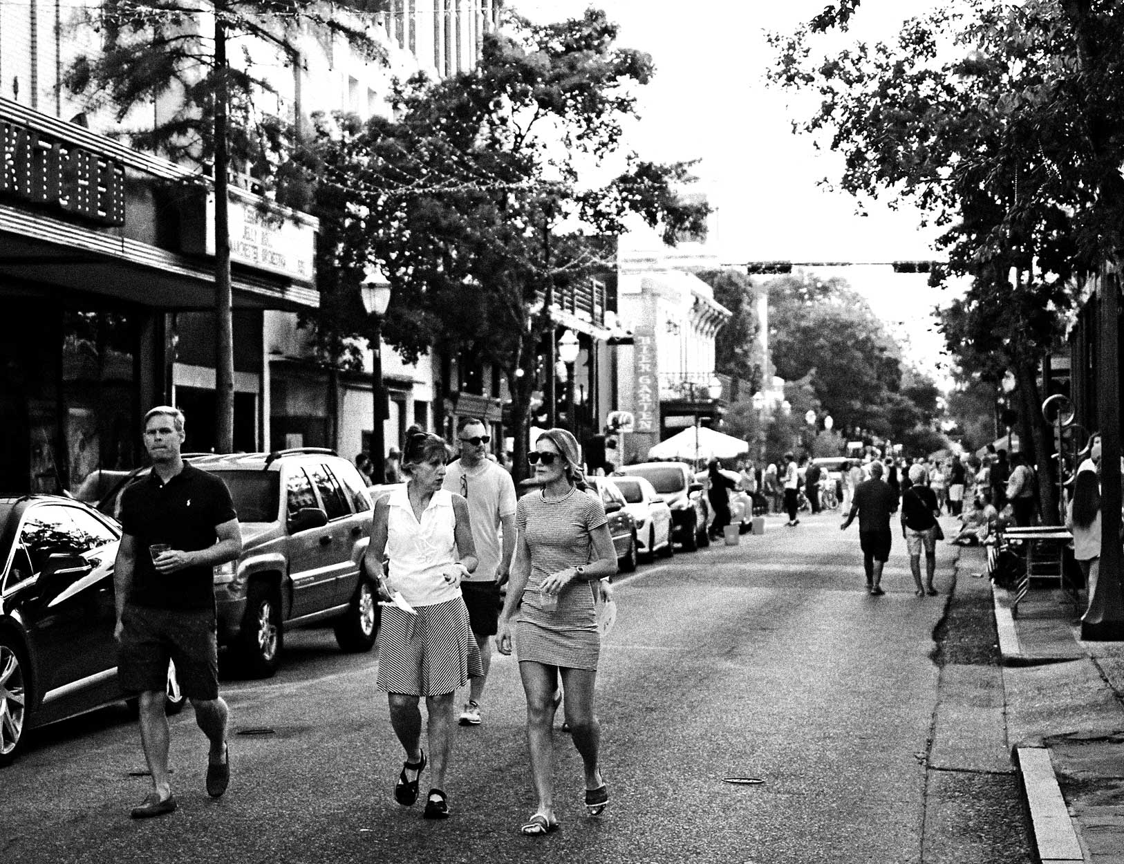 people walking down street downtown mobile